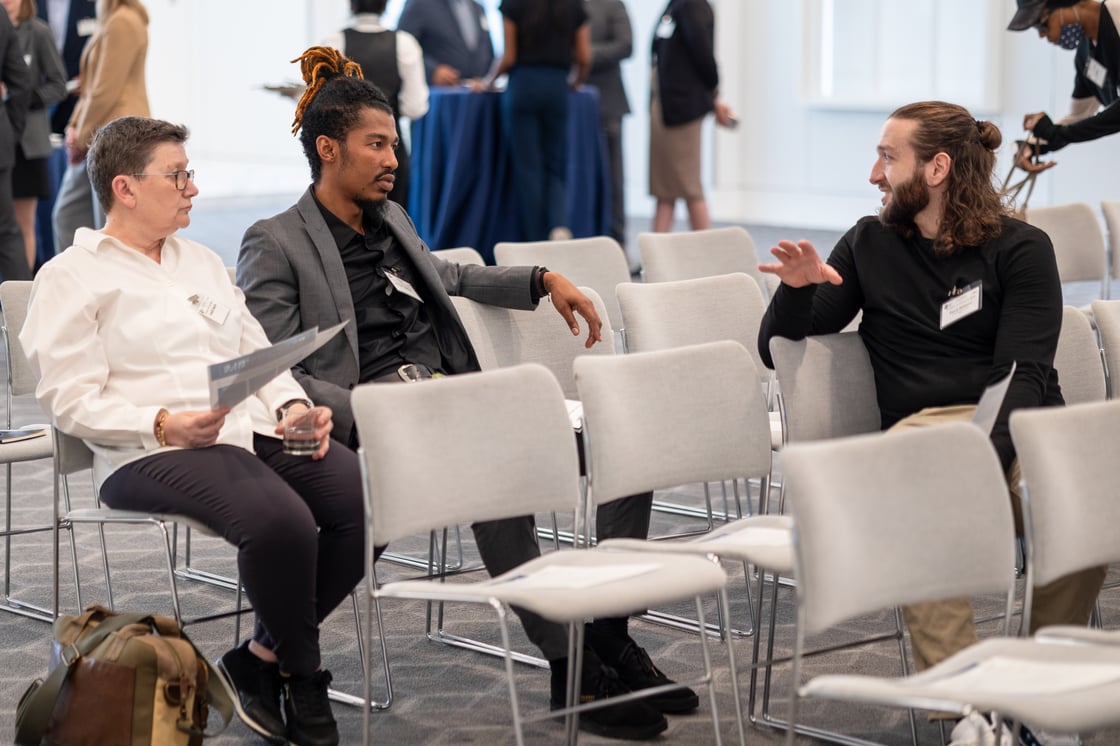 David (right) speaks with attendees of The Road to an Inclusive Workforce,